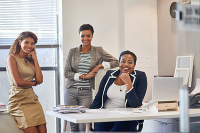 Buy stock photo Portrait of a group of female colleagues sitting together in an office