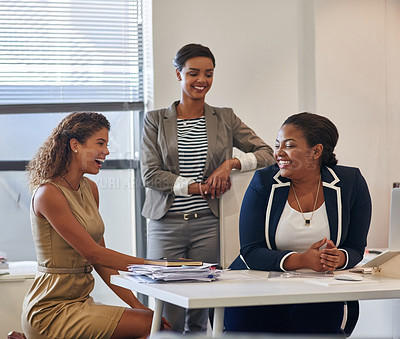 Buy stock photo Shot of a group of female colleagues talking together in an office