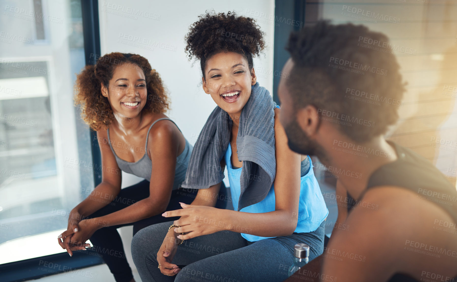 Buy stock photo Cropped shot of three young people sitting in the gym after yoga class