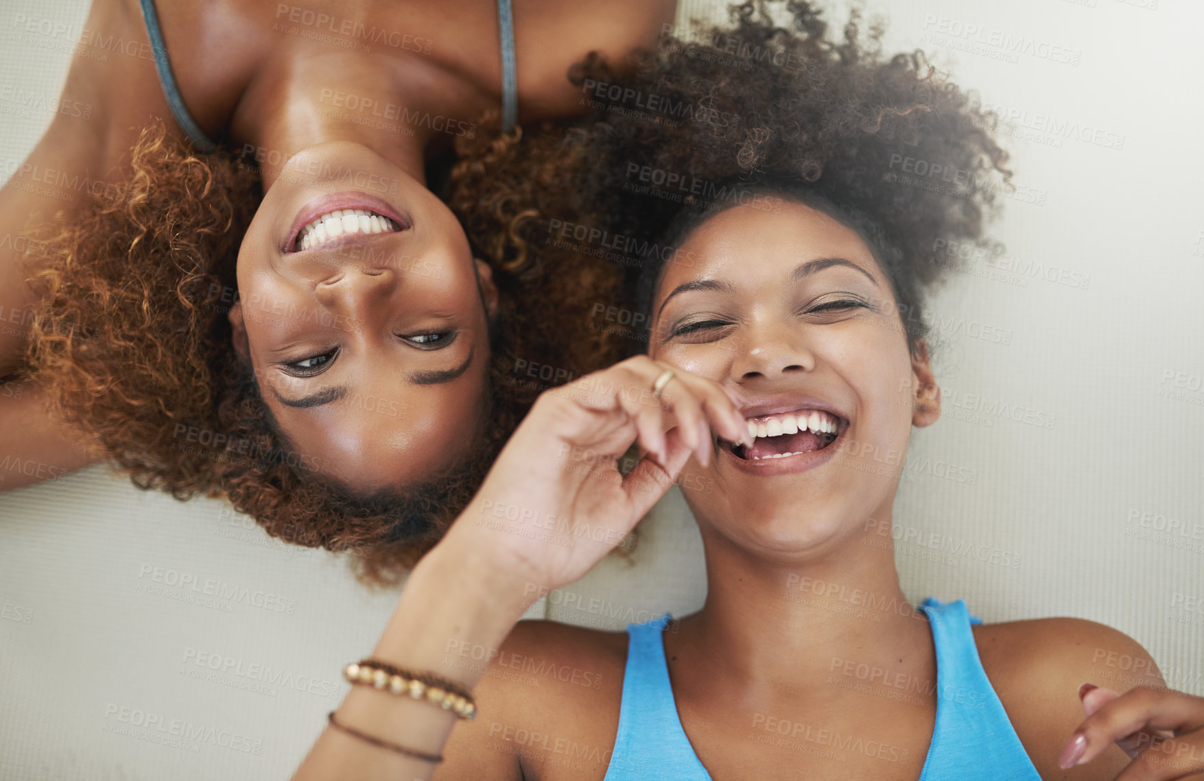 Buy stock photo Portrait, laughing and women on yoga class break for support, wellness or rest for health together. Above of face, relax and happy friends with pride, teamwork or smile in pilates studio on floor