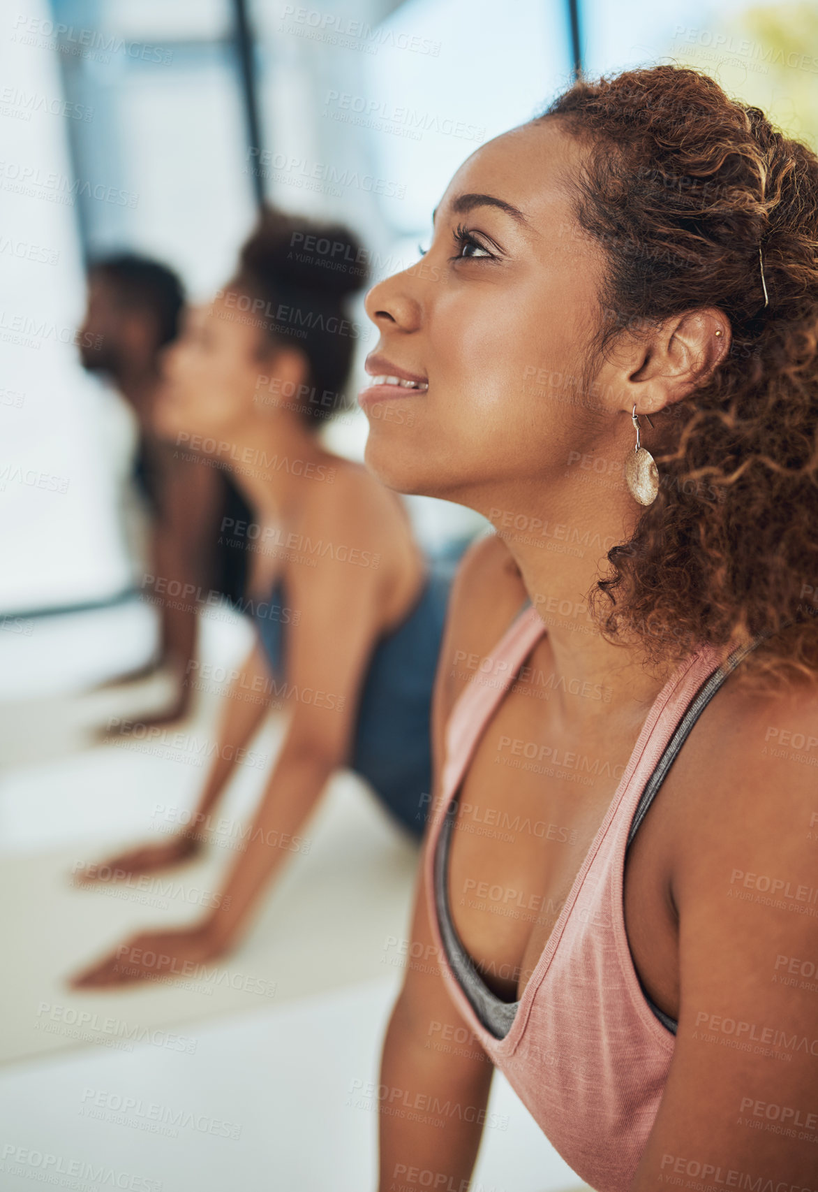 Buy stock photo Shot of a group of people doing yoga