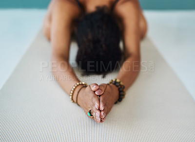 Buy stock photo Cropped shot of a young woman practising yoga