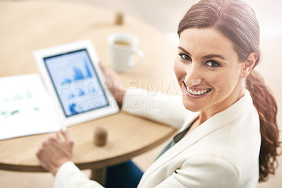 Buy stock photo Portrait of a young businesswoman using a digital tablet