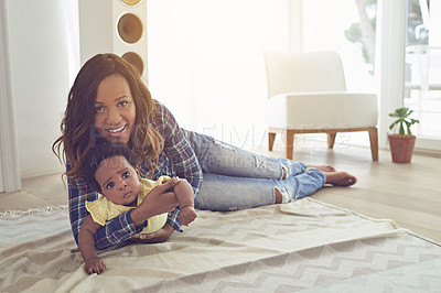 Buy stock photo Home, smile and mom with baby, portrait and bonding of family in living room, growth and development. Motherhood, new parent and black woman with child in lounge, love and care for infant in house