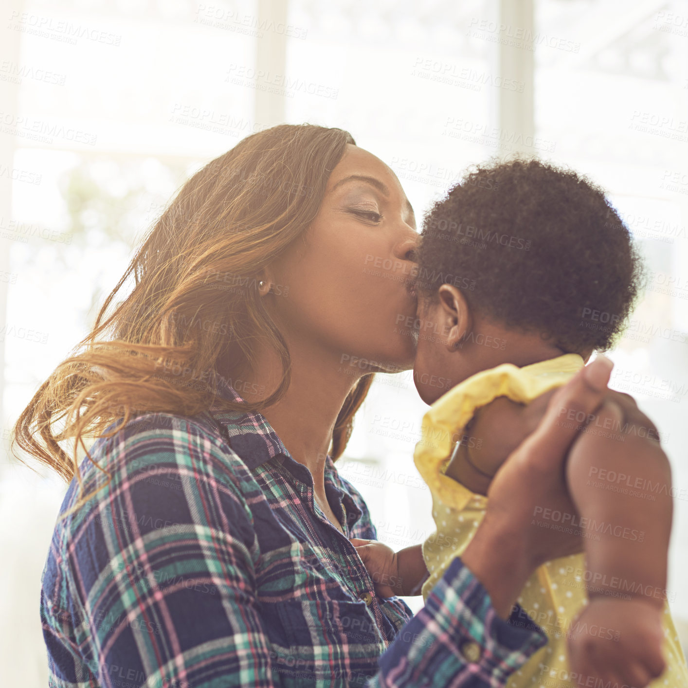 Buy stock photo Cropped shot of a young mother and her little baby girl at home