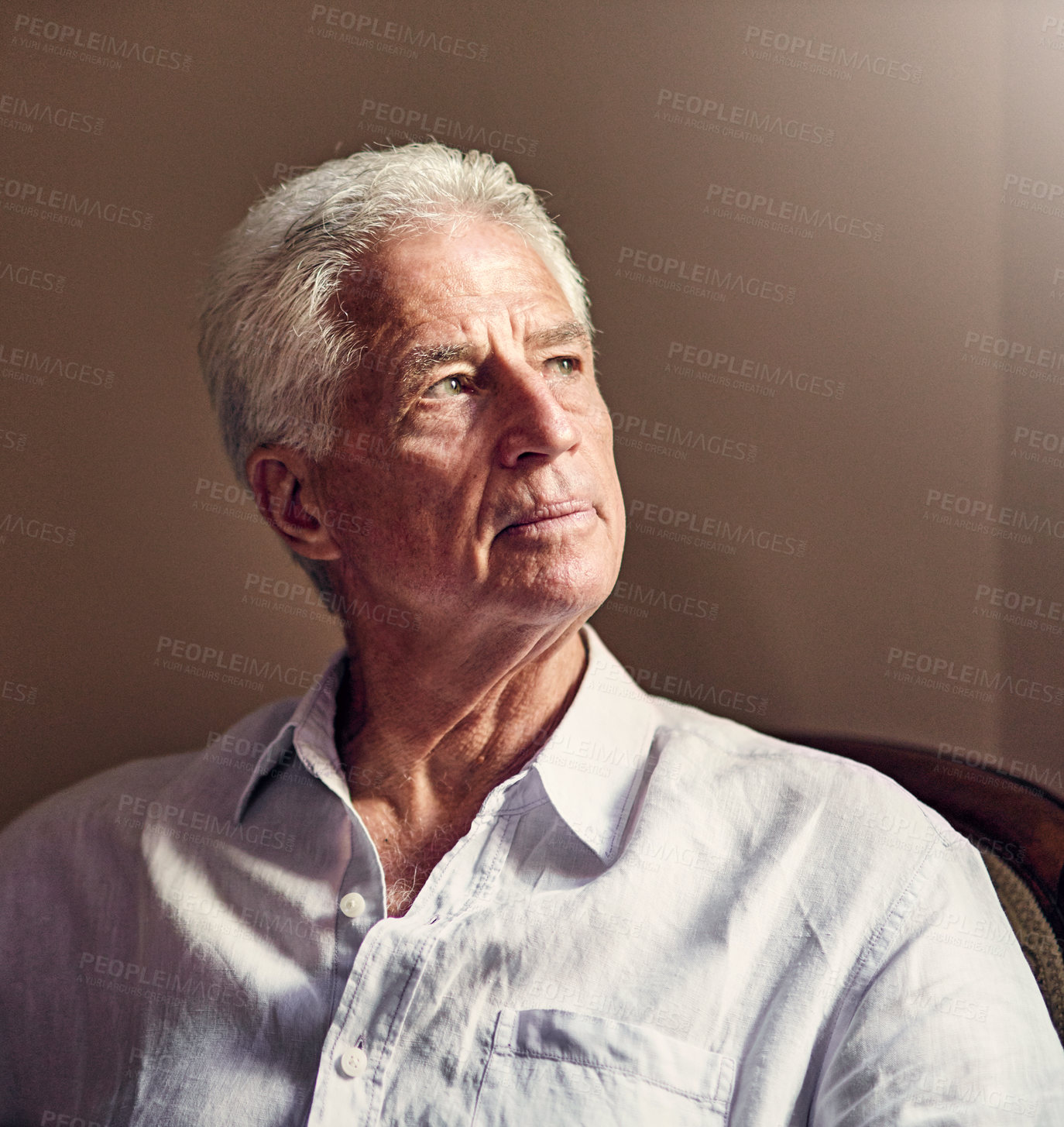 Buy stock photo Shot of a senior man looking thoughtful