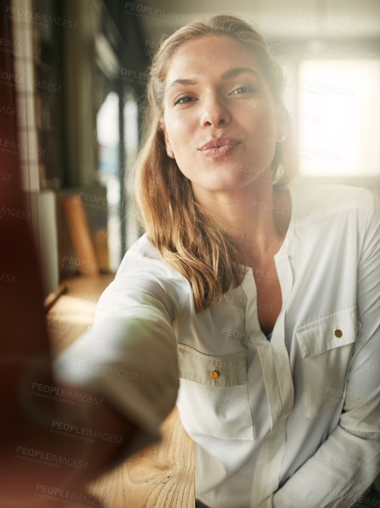 Buy stock photo Selfie, woman and kiss pose at cafe, coffee shop or restaurant and happy, lips and portrait of morning routine. Female person, face and pout or flirt, photograph for social media or profile picture