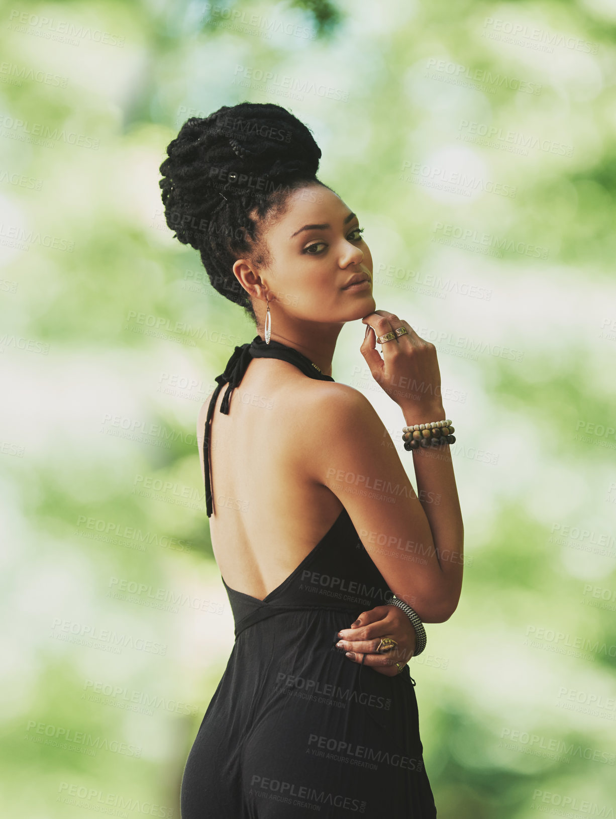 Buy stock photo Afro, fashion and portrait of African woman outdoor in garden for heritage or tradition. Back, confident and culture with serious model on green background in outfit for style sustainability