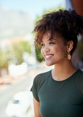 Buy stock photo Shot of a young businesswoman standing outside on a balcony