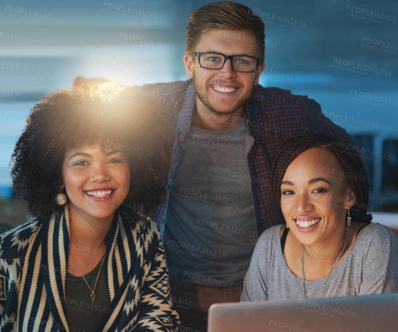 Buy stock photo Cropped portrait of a group of young people working late in the office