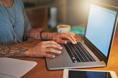 Buy stock photo High angle shot of a young woman working late in the office