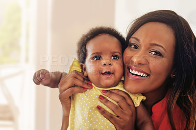 Buy stock photo Portrait of a mother holding up her baby girl