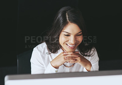Buy stock photo Shot of a young businesswoman working on a computer at work