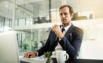 Buy stock photo Portrait of a businessman sitting in an office with his laptop in front of him