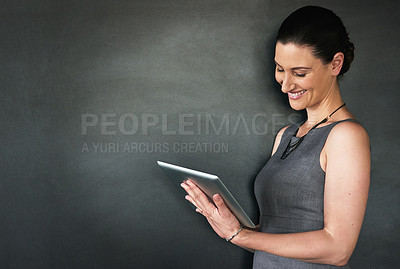 Buy stock photo Happy, business and woman in studio, tablet and confident person on gray background. Internet, model or corporate professional with tech, communication or digital app for trading, smile or connection