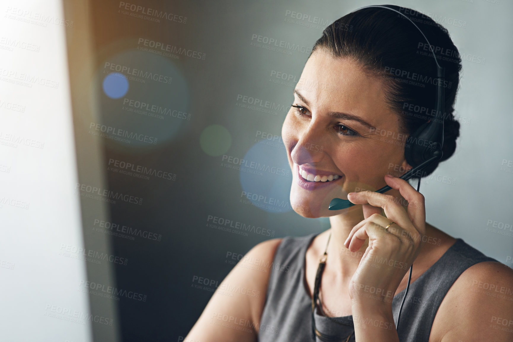 Buy stock photo Cropped shot of a female receptionist working in her office