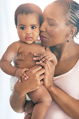 Buy stock photo Black woman with baby, love and hug with family, content and bonding with face and early childhood and happiness. African female, mother holding child with parenting, motherhood and cuddle with care