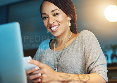 Buy stock photo Cropped portrait of a young woman sending an sms while working late in her office