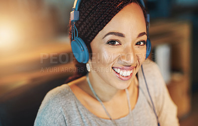 Buy stock photo African woman, happy and headphones in office for business, pride and project deadline at night. Web designer, portrait and music app in workplace for radio, streaming and listening to podcast audio