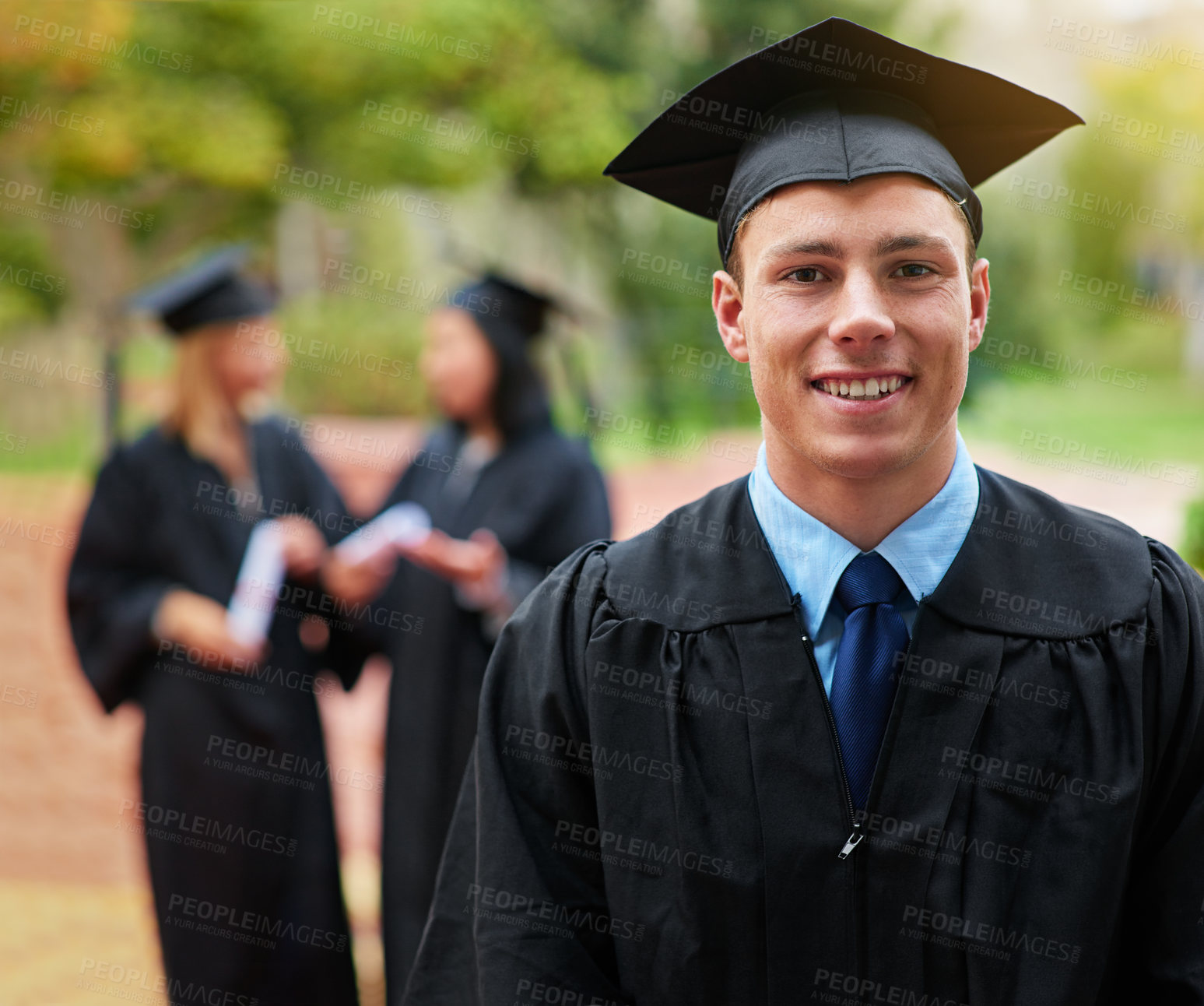 Buy stock photo Portrait, graduation and smile with student man outdoor on campus for college or university ceremony. Face, education and scholarship with happy young graduate at ceremony for success or achievement