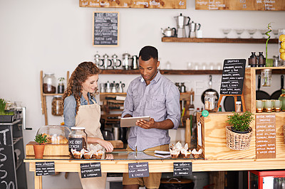 Buy stock photo Small business owners, tablet and teamwork of people, manage orders and discussion in store. Waiters, black man and happy woman in cafe with technology for inventory, stock check and managing sales.