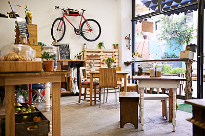 Buy stock photo Interior, bike on wall of empty coffee shop with tables and chairs for retail, service or hospitality. Space, small business or startup restaurant with cafeteria seating for bistro consumerism