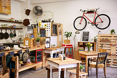 Buy stock photo Space, interior and empty coffee shop with table, chairs and furniture or small business, bistro and cafe with unique design and style. Background, creative startup and food store with bike on wall