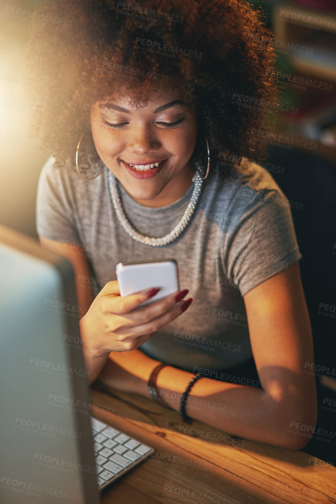 Buy stock photo Night, reading and happy woman at desk with phone, laptop and search on social media for networking. Smartphone, scroll and consultant on mobile app for article, email or online chat in dark office