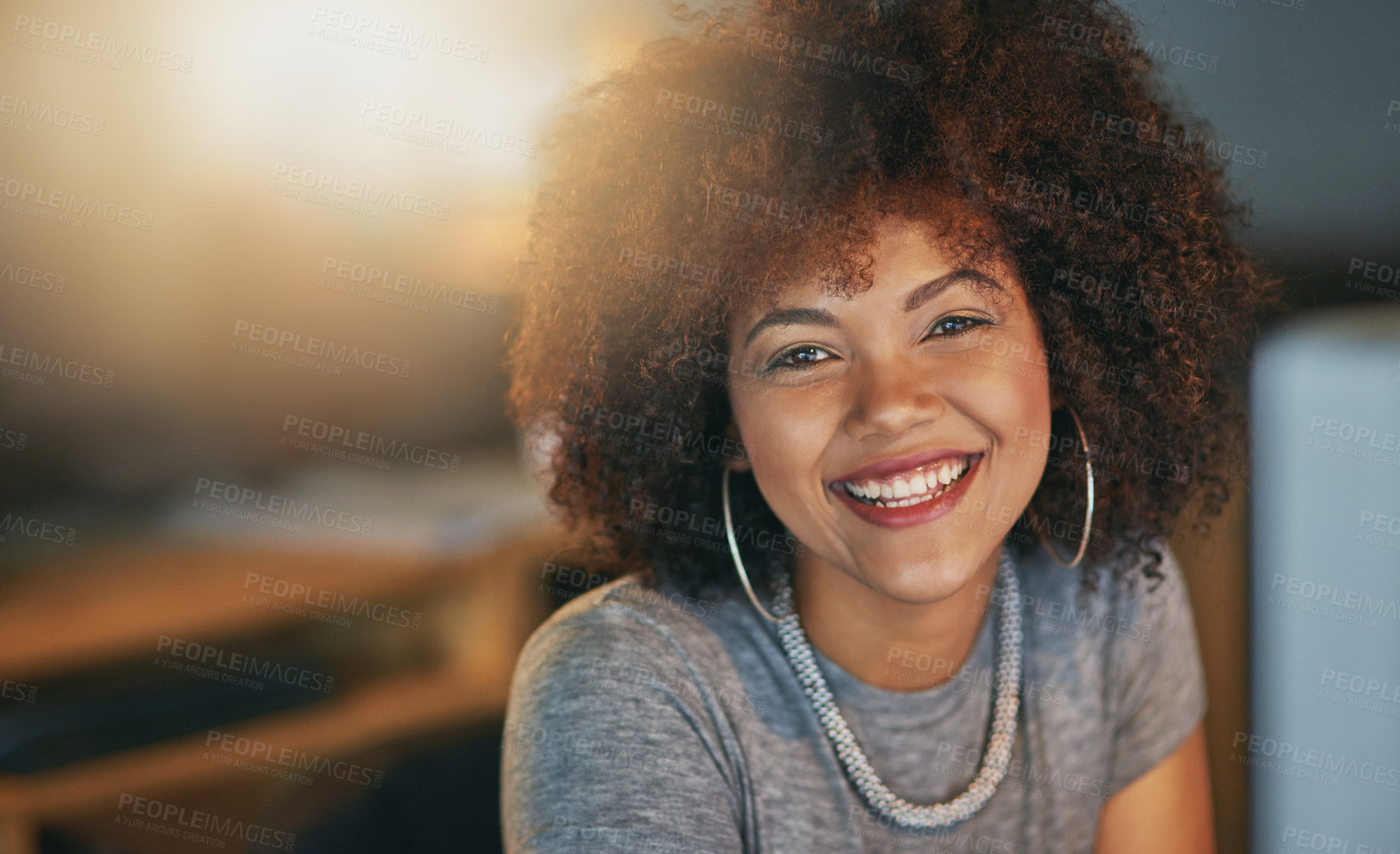 Buy stock photo Computer, portrait and African woman in office at night, working at desk for administration deadline. Afro, desktop and smile of designer person in creative workplace for evening report or research