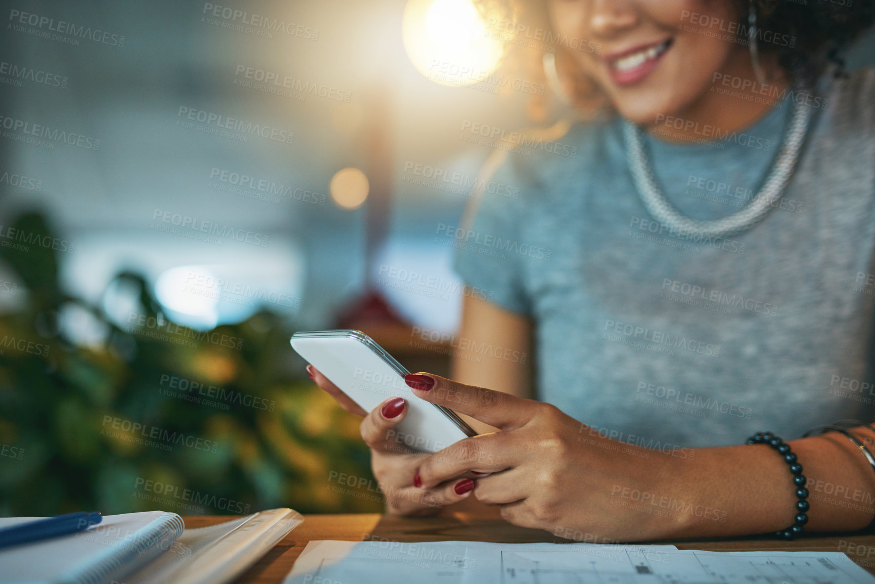 Buy stock photo Night, hands and woman in office with phone, typing or search on social media website for architecture. Smartphone, scroll and designer on mobile app for article, email or online chat at desk in dark