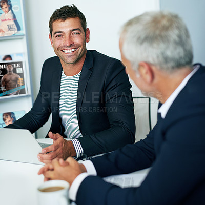 Buy stock photo Portrait of a young businessman in an office with a colleague