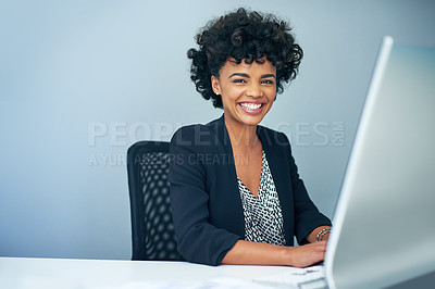 Buy stock photo Portrait of a businesswoman sitting at her computer in an office