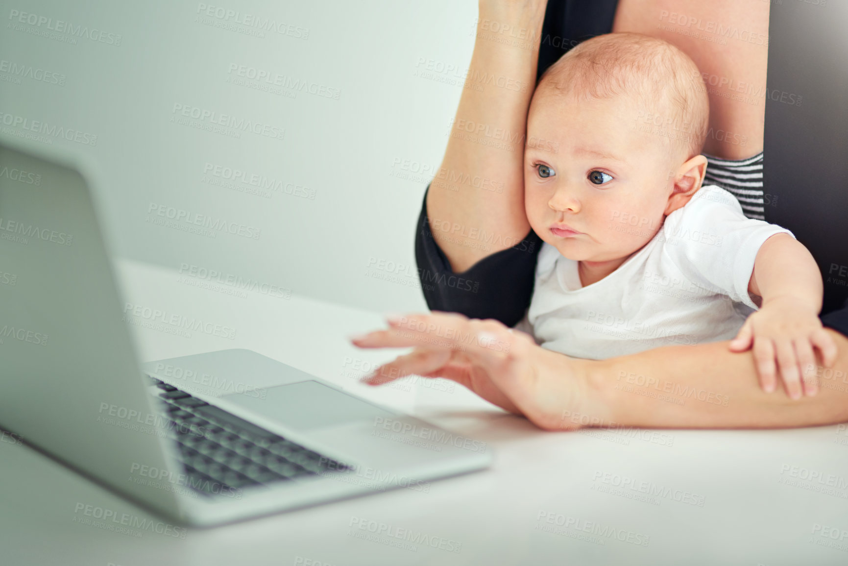 Buy stock photo Mother, entrepreneur and laptop with baby in home for remote work, multitasking and freelance writer. Professional, copywriter and woman hand with curious child for editing blog post and review email