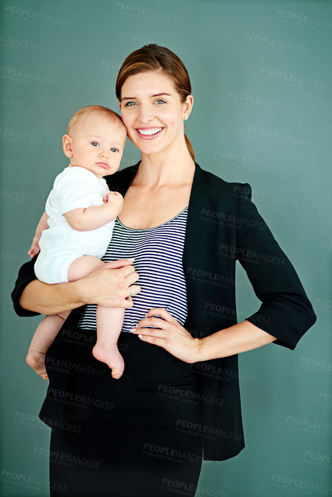 Buy stock photo Businesswoman, baby and portrait in studio for motherhood, ambition or bonding with background. Lawyer, happy and carrying child with pride for support, responsibility and single mother with smile