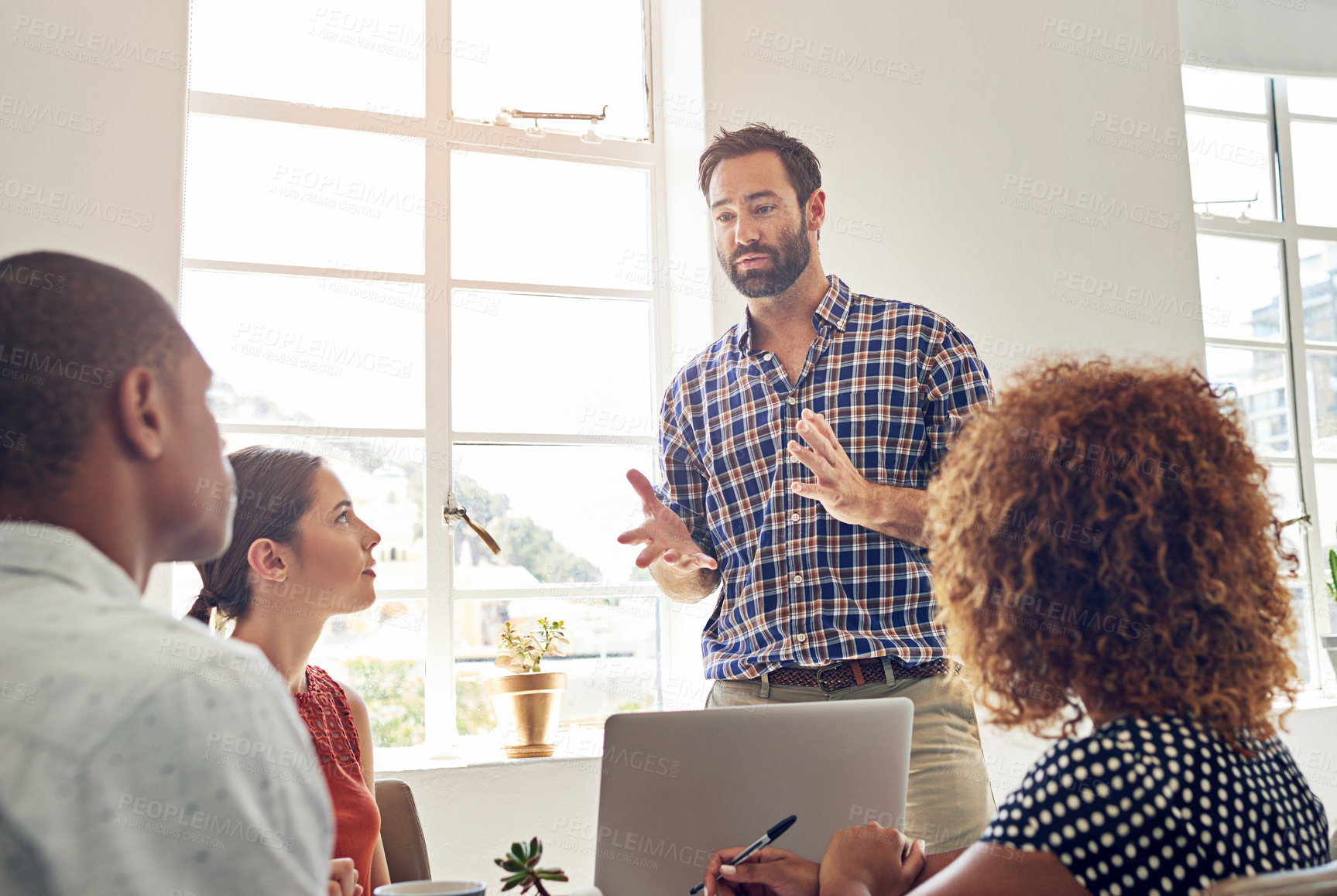 Buy stock photo Shot of a group of colleagues having a meeting in an office