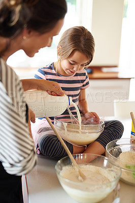 Buy stock photo Mother, milk or kid baking in kitchen as a family with a young kid learning cookies or cake recipe at home. Pastry, cooking or mother baker helping or teaching daughter to bake for child development