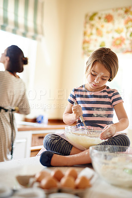 Buy stock photo Mom, mixing or girl child baking in kitchen as a family with kid learning cookies pastry recipe at home. Blur, cooking independence or baker helping or teaching child to bake for skills development 