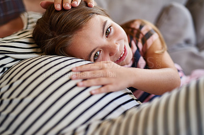 Buy stock photo Shot of a young girl cuddling her pregnant mother’s stomach