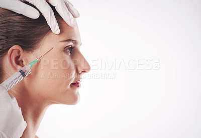 Buy stock photo Woman, hand and eyebrow injection in studio or cosmetic filler for beauty, plastic surgery or white background. Female person, needle and skincare procedure or anti aging, dermatology or mockup space