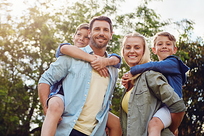 Buy stock photo Cropped shot of a family of four walking in the woods