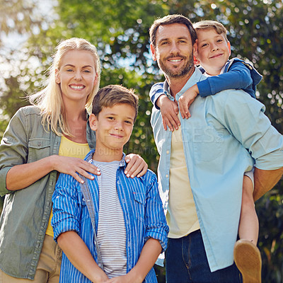 Buy stock photo Cropped portrait of a family of four walking in the woods