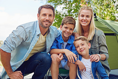 Buy stock photo Cropped portrait of a family of four camping in the woods