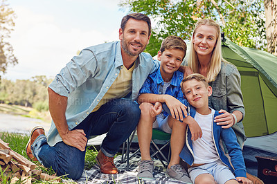 Buy stock photo Cropped portrait of a family of four camping in the woods