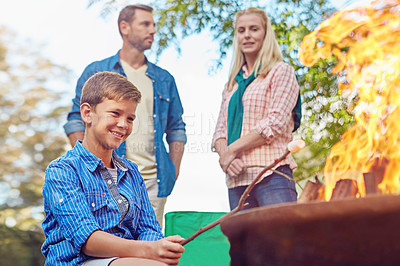 Buy stock photo Cropped shot of a family of three camping in the woods