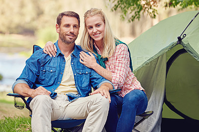 Buy stock photo Portrait of an affectionate couple camping out in the woods