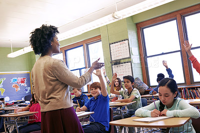 Buy stock photo Teacher, students and classroom with hands for question, answer or FAQ of engaging children. Happy female educator teaching enthusiastic kids for learning, education or development in class