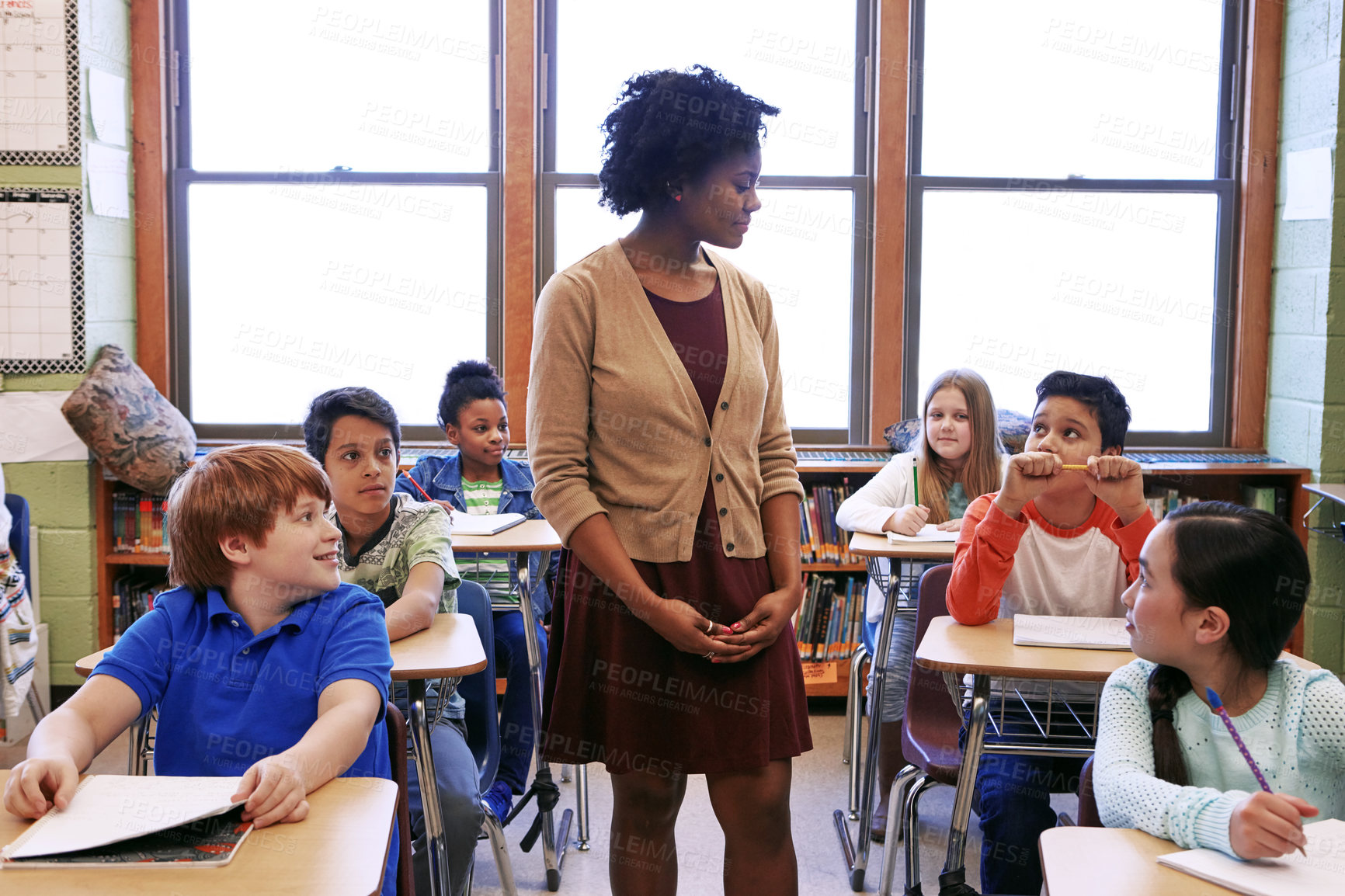 Buy stock photo Students, education and lesson with woman in classroom for child development, growth and knowledge. Lecture, learning and teaching with person and kids in school for support, academy and teacher