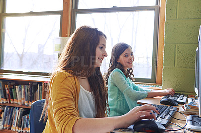 Buy stock photo Shot of elementary children working on computers at school