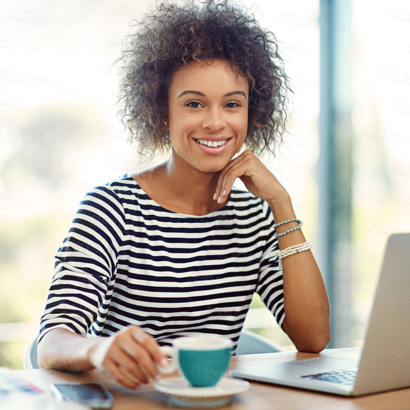 Buy stock photo Portrait of a young woman drinking a coffee while working on a laptop at home