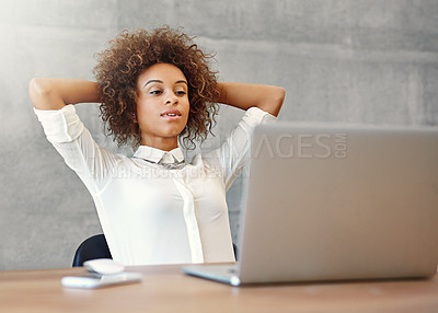 Buy stock photo Shot of a content young woman working on a laptop at home